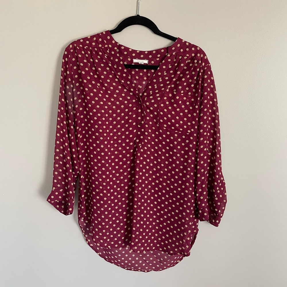 Pleione red tunic with white polka dots. 3/4 length sleeves.